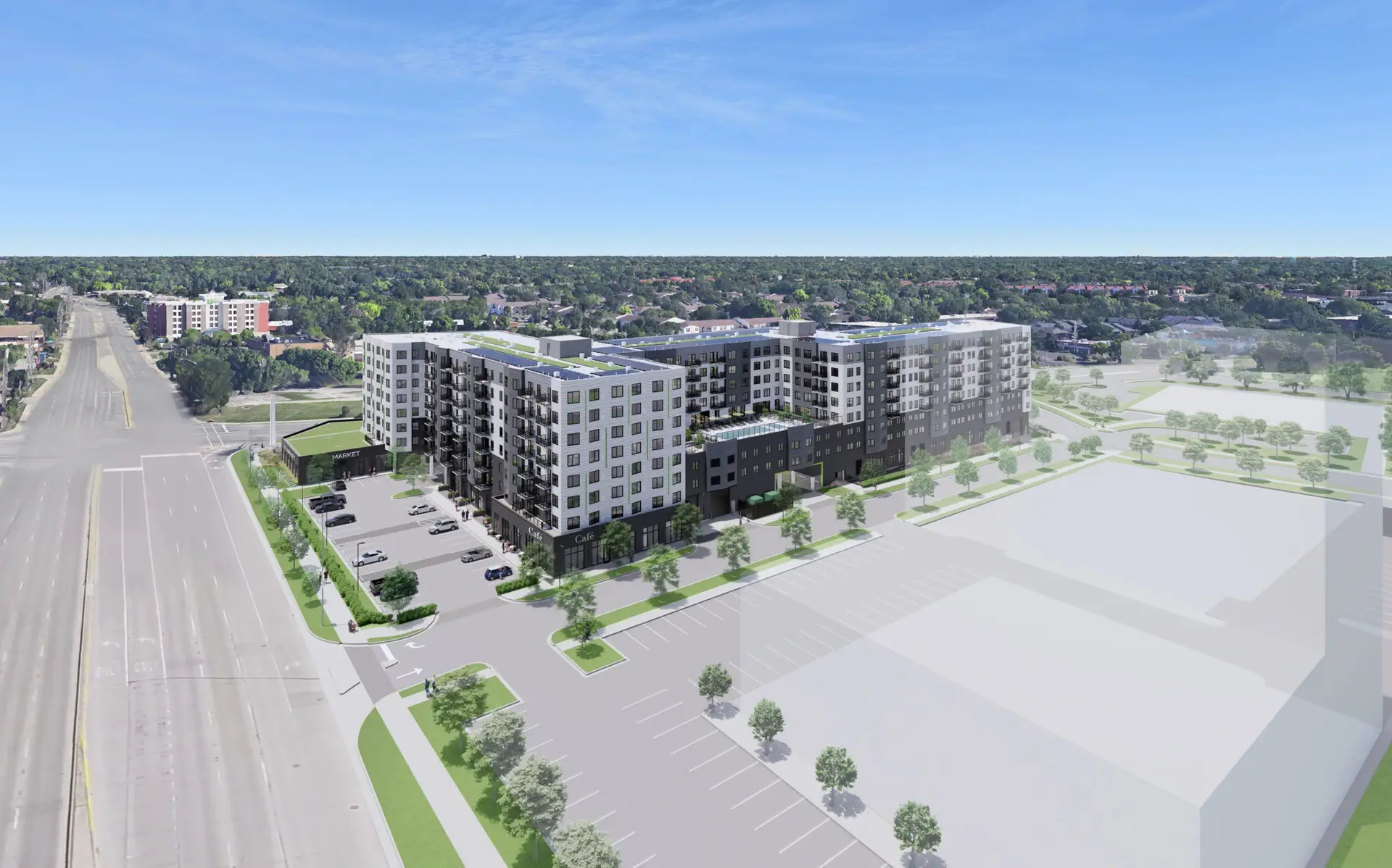 Aerial view of a modern residential and retail development.