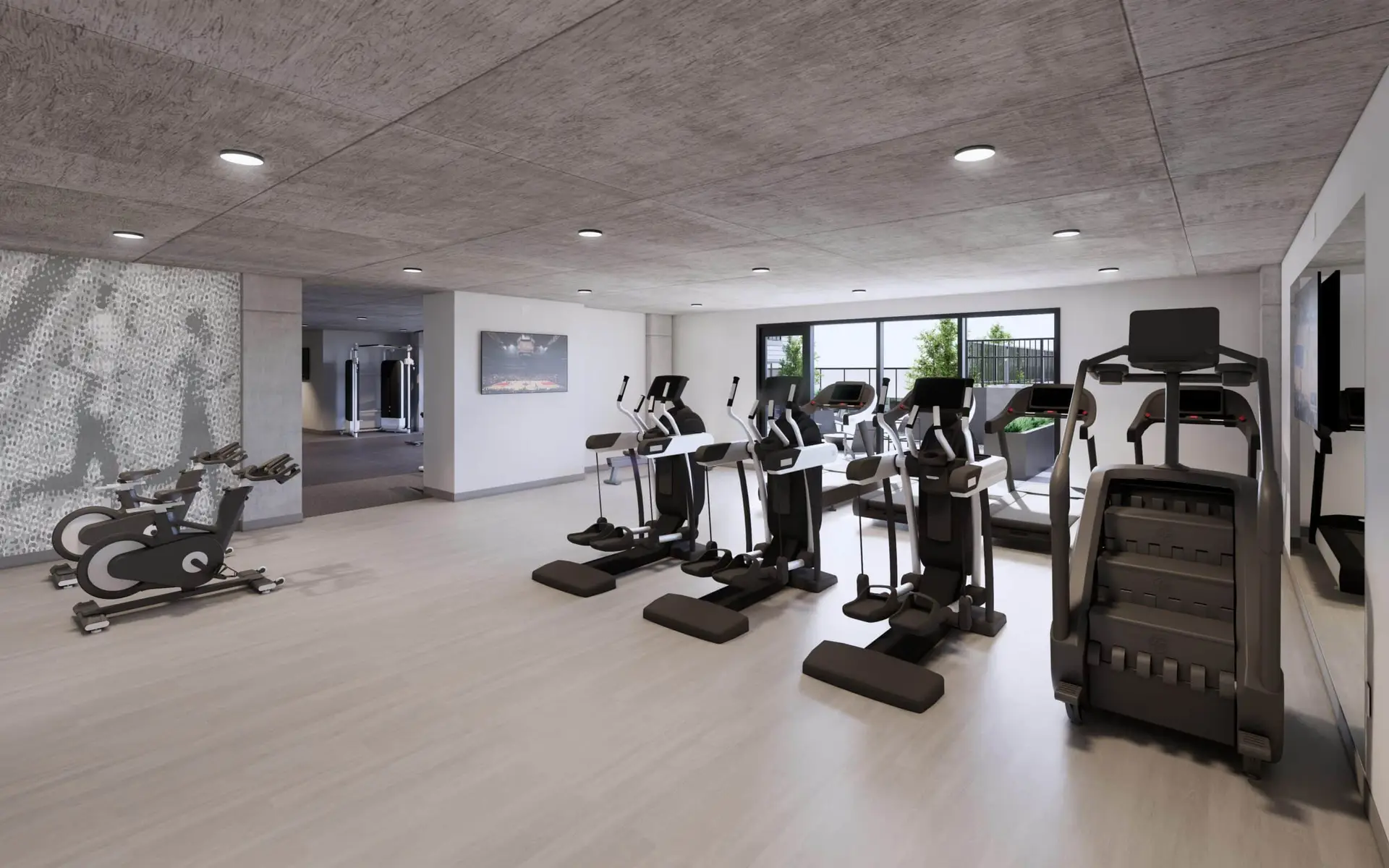 Modern cardio room with treadmills, bikes, and bright lighting.