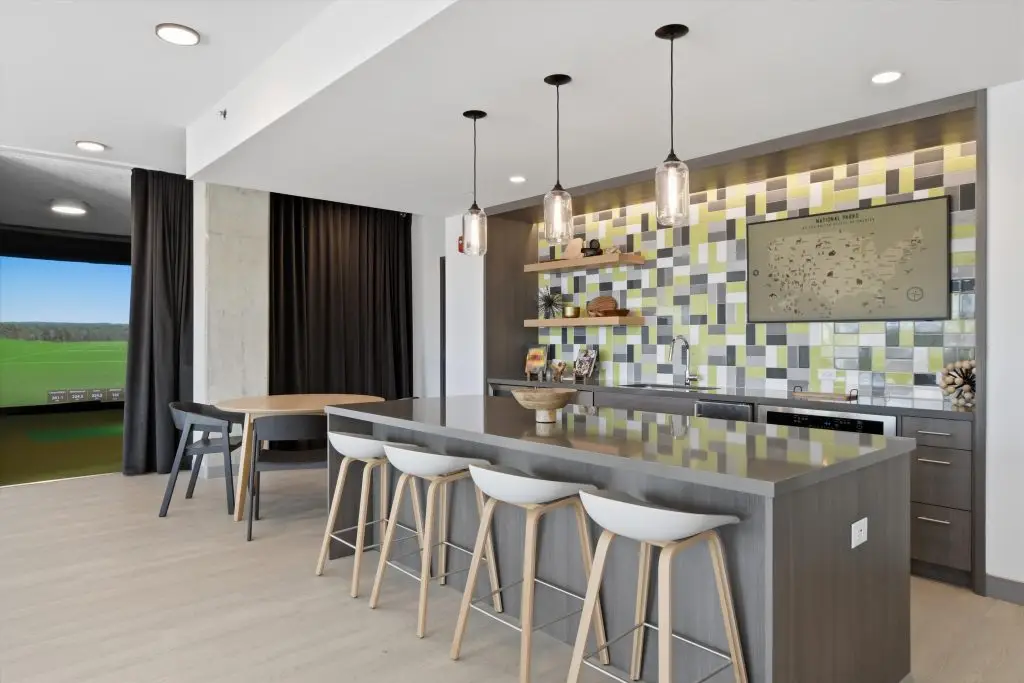 Spacious lobby area with modern furniture and lighting fixtures.